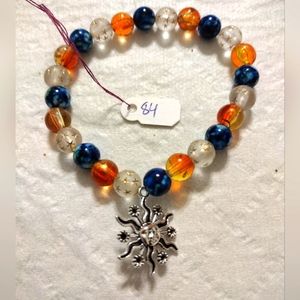 Artemis's Gems custom-made beaded bracelet with metal sun charm